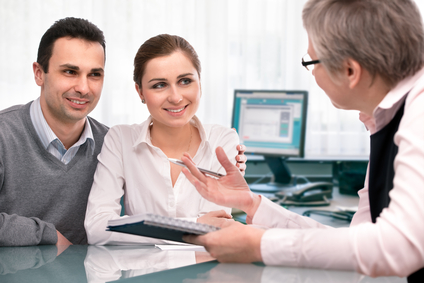 Cheerful young couple at financial planning consultation